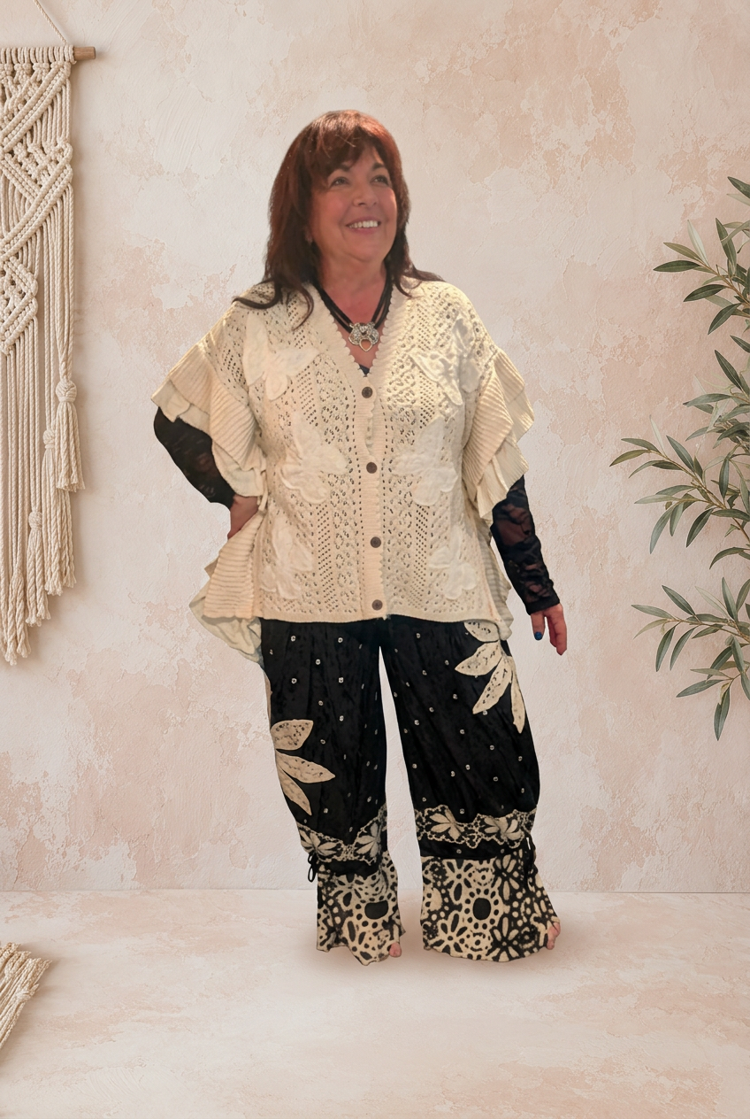 Cream top front view with pale plaster background