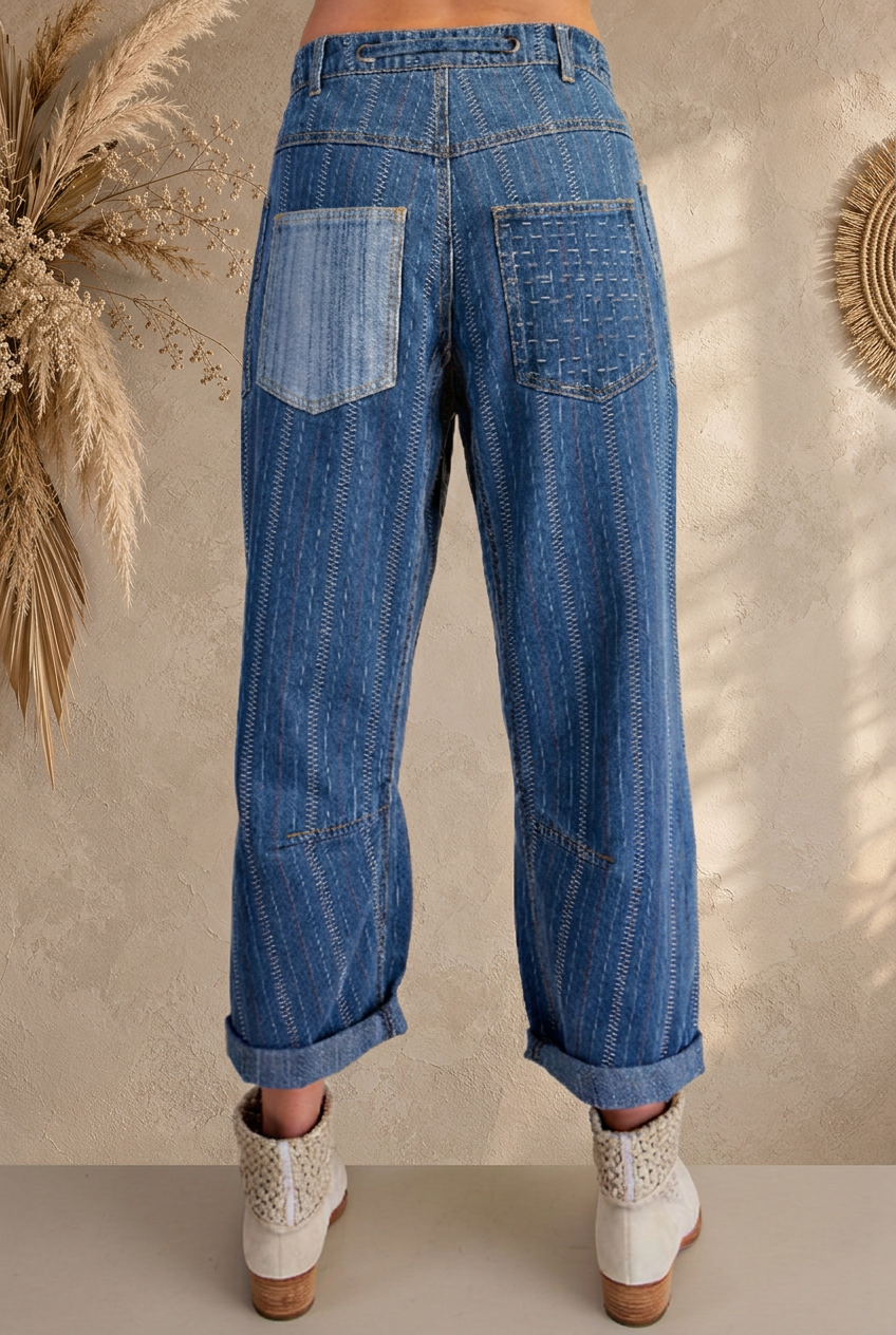 Denim pants back view with beige boho background