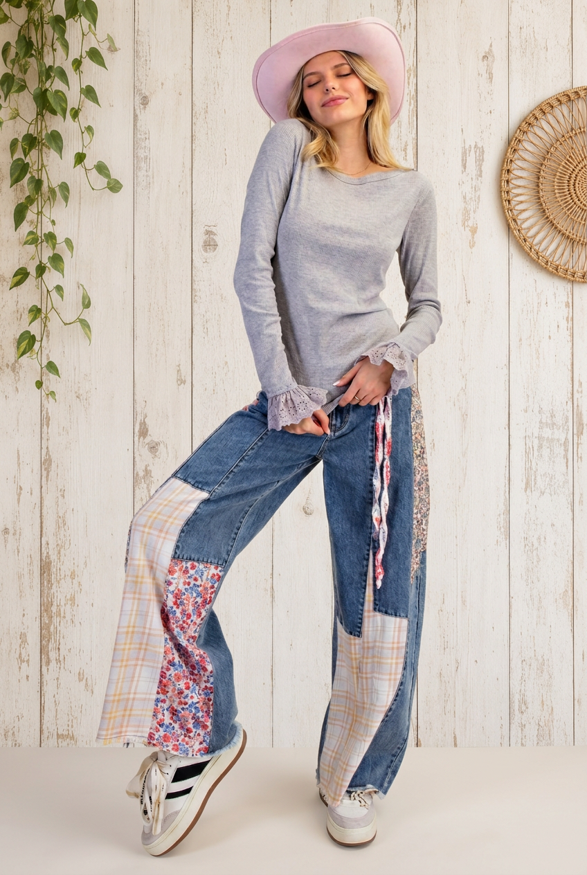 Full-length gray sweater outfit with whitewashed wood backdrop