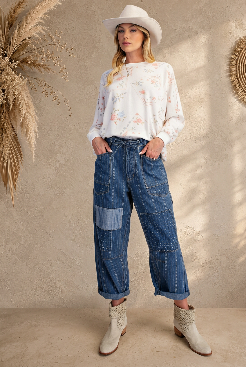 Modeled denim outfit with beige boho background