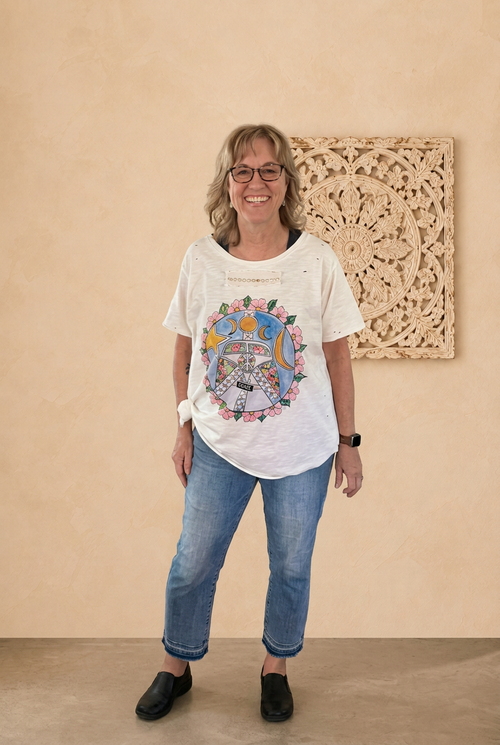 T-shirt preview with a fictional model face and beige boho backdrop